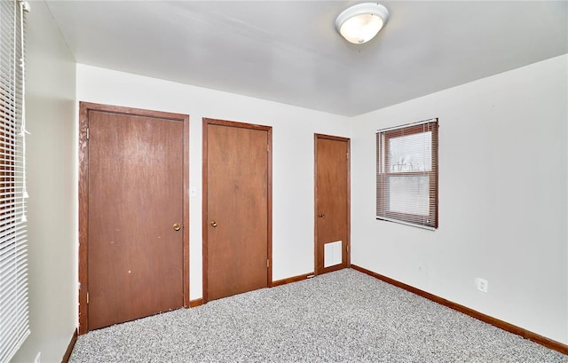1991 State Highway H, Sikeston, MO 63780 - unfurnished bedroom with multiple closets, carpet floors, and baseboards