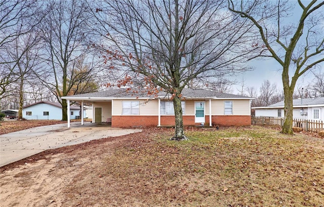1991 State Highway H, Sikeston, MO 63780 - view of front of home with brick siding, fence, driveway, and a carport