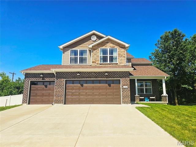 104 Eisenhower Blvd, Troy, IL 62294 - view of front of home featuring concrete driveway, brick siding, and a shingled roof