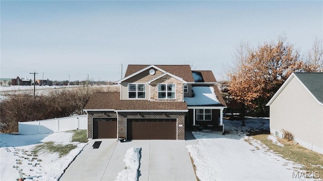 104 Eisenhower Blvd, Troy, IL 62294 - view of front of house featuring concrete driveway, fence, an attached garage, roof with shingles, and brick siding