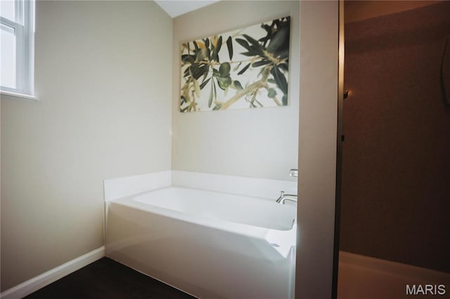 104 Eisenhower Blvd, Troy, IL 62294 - bathroom with a bath and baseboards