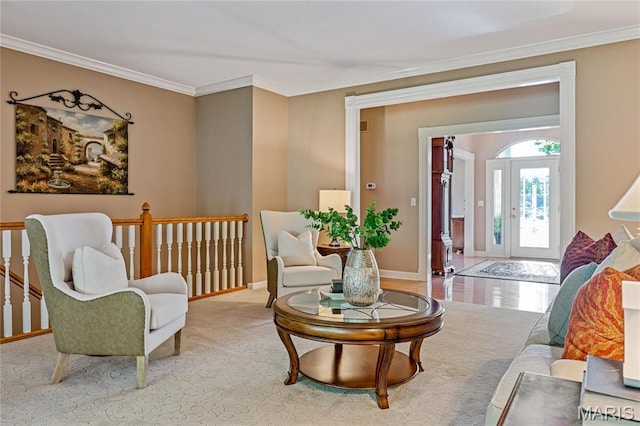 living room featuring crown molding and baseboards