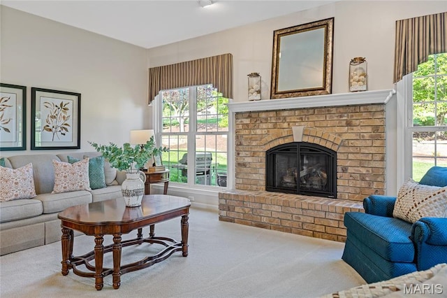 carpeted living room featuring a fireplace