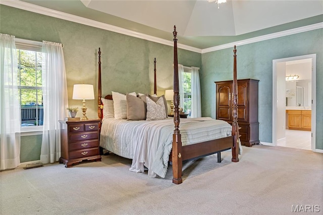 bedroom featuring light carpet, multiple windows, ornamental molding, baseboards, and ensuite bathroom