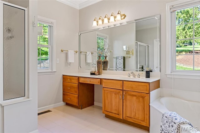 full bathroom with a shower stall, plenty of natural light, vanity, tile patterned flooring, and ornamental molding
