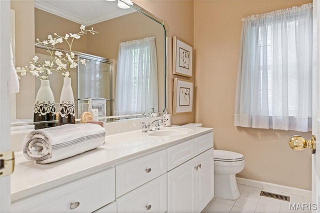 bathroom featuring ornamental molding, vanity, a shower stall, baseboards, and toilet