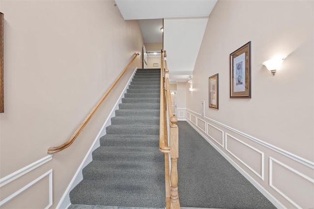 1163 Mill Crossing Dr Unit 205, Creve Coeur, MO 63141 - stairs with carpet flooring, a decorative wall, and a wainscoted wall