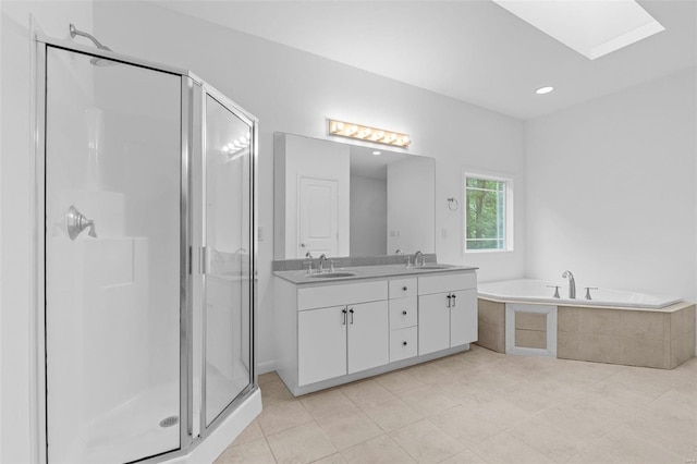 bathroom with a stall shower, double vanity, a bath, and tile patterned floors