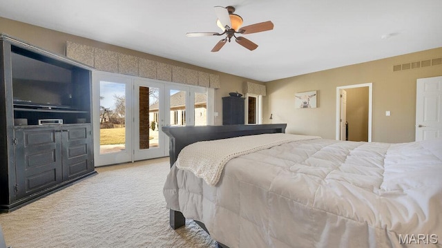 bedroom with french doors, access to exterior, light carpet, and a ceiling fan
