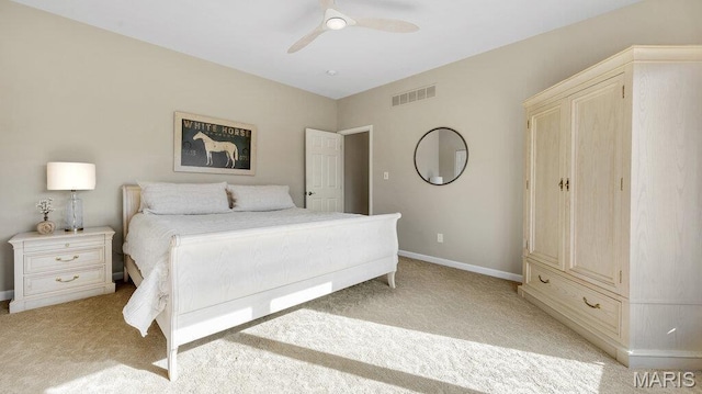 bedroom featuring light carpet, baseboards, and ceiling fan