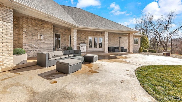 view of patio featuring french doors, area for grilling, and outdoor lounge area