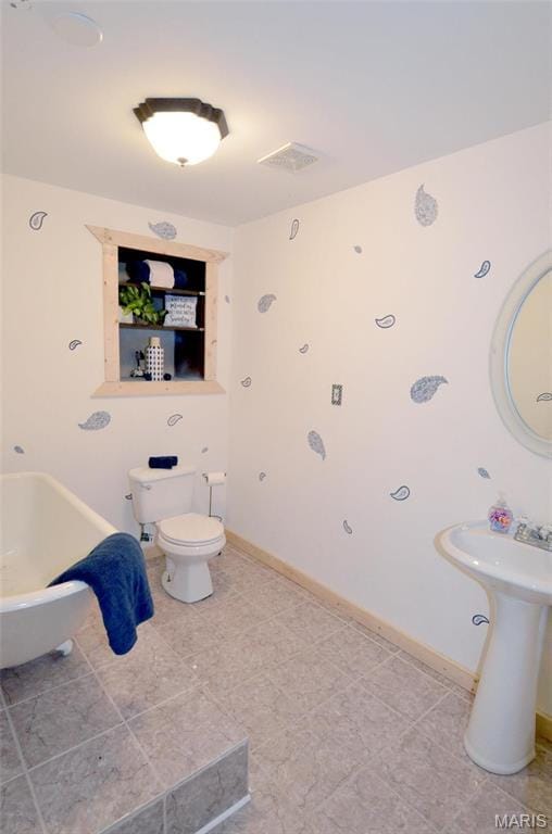 936 Palamino Path, High Ridge, MO 63049 - full bathroom with toilet, a tub to relax in, and baseboards