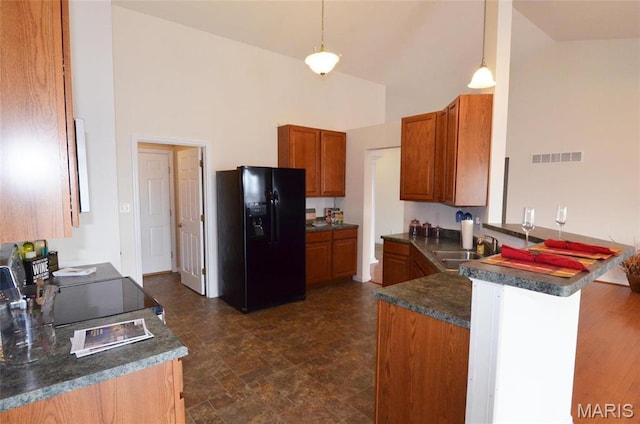 936 Palamino Path, High Ridge, MO 63049 - kitchen featuring black refrigerator with ice dispenser, high vaulted ceiling, brown cabinetry, a sink, and a peninsula