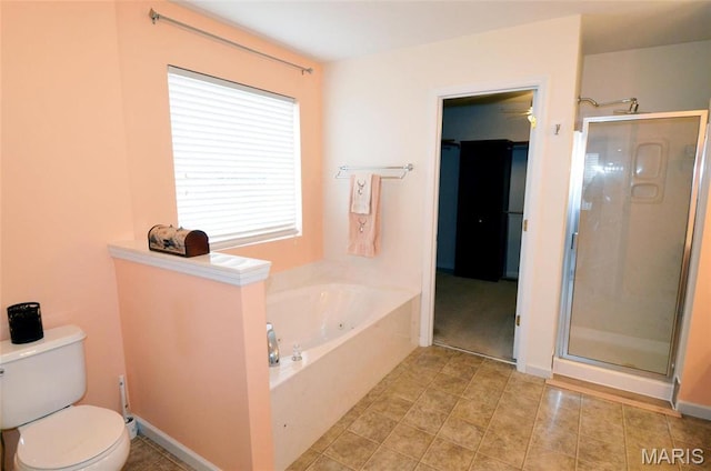 936 Palamino Path, High Ridge, MO 63049 - bathroom featuring a shower stall, toilet, a garden tub, and tile patterned floors