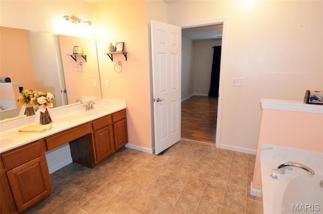 936 Palamino Path, High Ridge, MO 63049 - bathroom with double vanity, a garden tub, baseboards, and tile patterned flooring