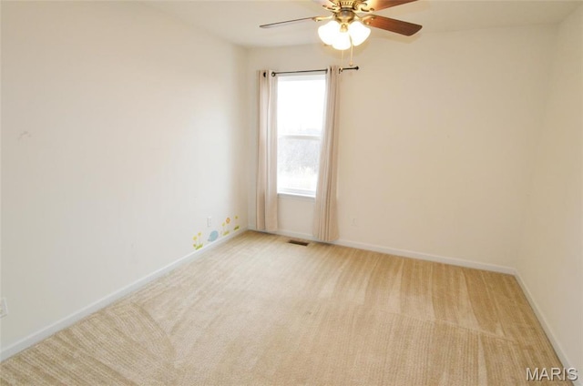 936 Palamino Path, High Ridge, MO 63049 - spare room with light carpet, a ceiling fan, and baseboards