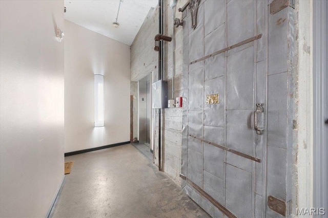 1619 Washington Ave Unit 805, Saint Louis, MO 63103 - hallway featuring finished concrete flooring and a towering ceiling