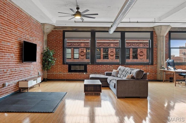 1619 Washington Ave Unit 805, Saint Louis, MO 63103 - living room featuring hardwood / wood-style flooring, brick wall, and ceiling fan