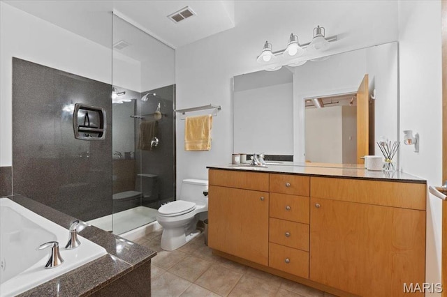 1619 Washington Ave Unit 805, Saint Louis, MO 63103 - bathroom featuring vanity, a tile shower, a bath, and tile patterned floors