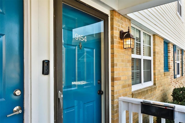 9154 Eager Rd, Saint Louis, MO 63144 - property entrance with brick siding