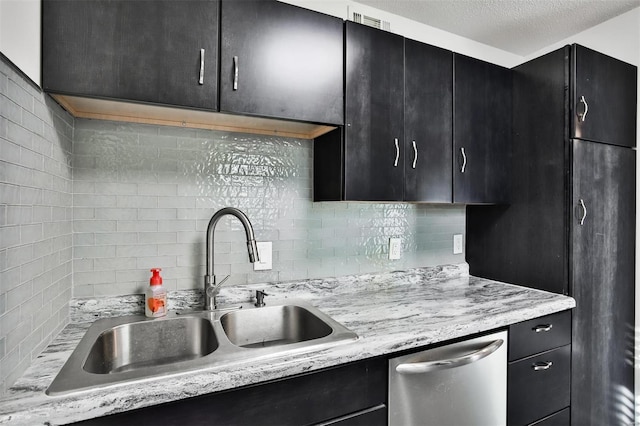9154 Eager Rd, Saint Louis, MO 63144 - kitchen with dishwasher, dark cabinets, a sink, tasteful backsplash, and a textured ceiling