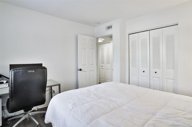 9154 Eager Rd, Saint Louis, MO 63144 - bedroom with a closet, wood finished floors, and an office area