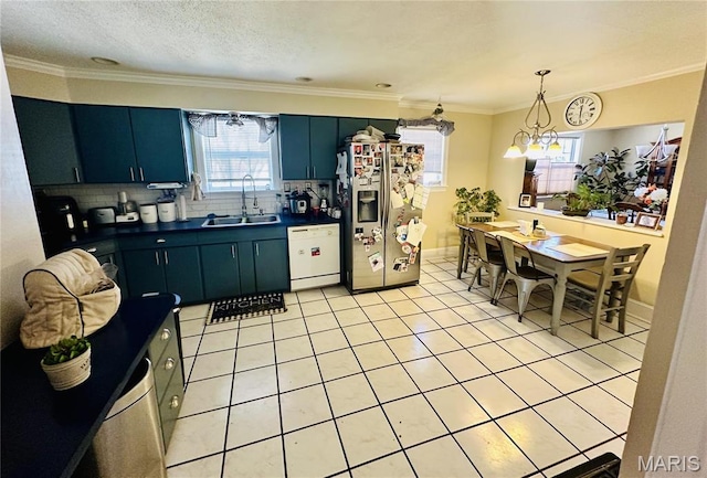 125 Hull Ave, Saint Louis, MO 63119 - kitchen with stainless steel refrigerator with ice dispenser, white dishwasher, a sink, dark countertops, and decorative backsplash