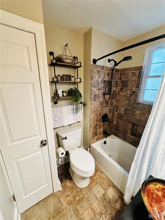 125 Hull Ave, Saint Louis, MO 63119 - bathroom featuring shower / bath combo with shower curtain and toilet