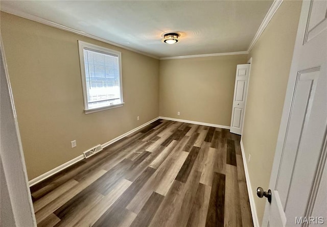 125 Hull Ave, Saint Louis, MO 63119 - empty room with ornamental molding, dark wood-style floors, and baseboards