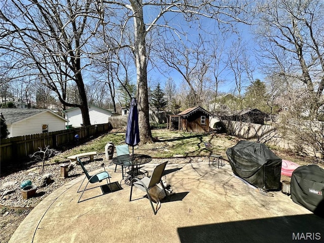125 Hull Ave, Saint Louis, MO 63119 - view of patio featuring a fenced backyard and an outdoor structure