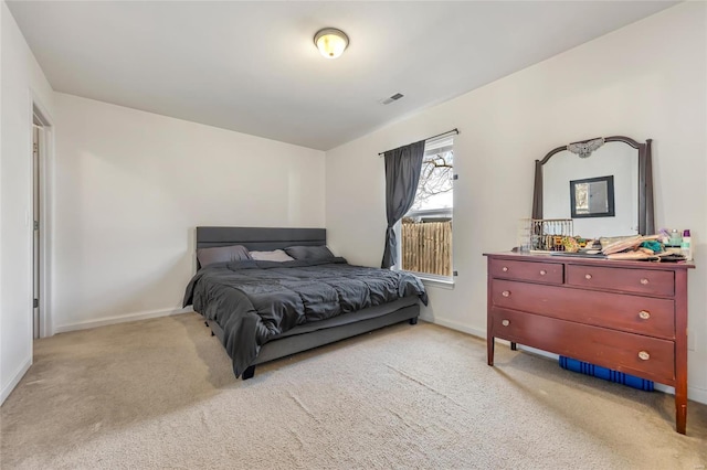 bedroom with carpet flooring and baseboards