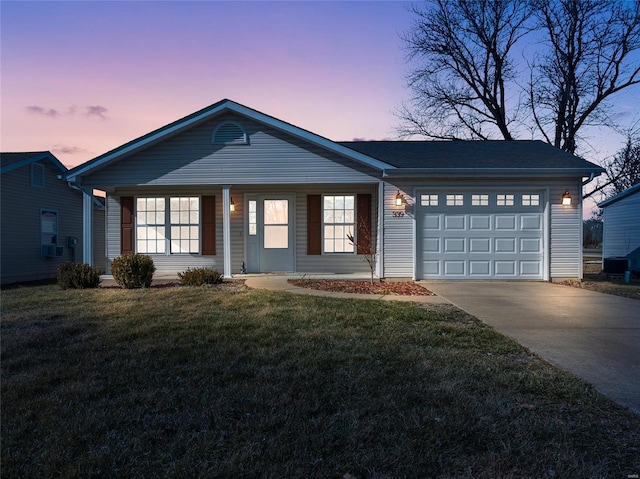 ranch-style home with concrete driveway, a garage, and a lawn