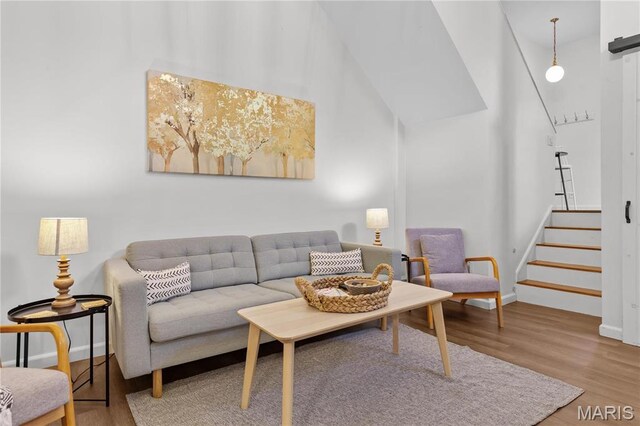 2005 Lynch St Unit C, Saint Louis, MO 63118 - living room with baseboards, wood finished floors, and stairs