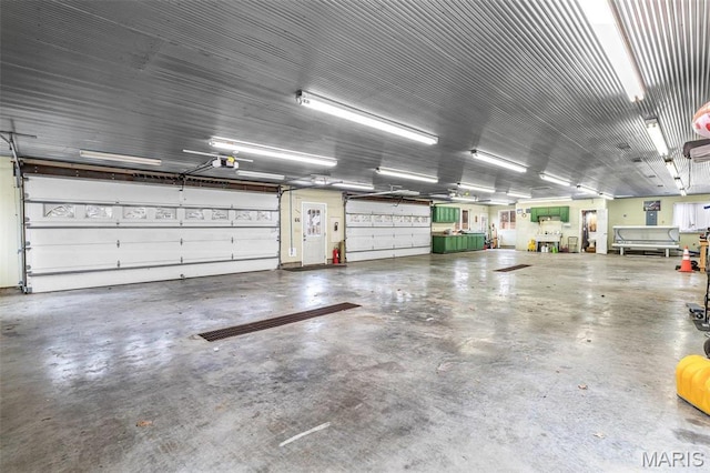 616 W Columbia St, Farmington, MO 63640 - garage featuring a garage door opener