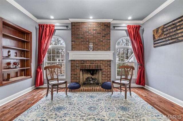 616 W Columbia St, Farmington, MO 63640 - sitting room featuring ornamental molding, wood finished floors, a fireplace, and recessed lighting