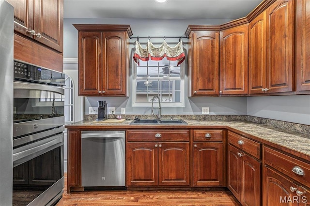 616 W Columbia St, Farmington, MO 63640 - kitchen featuring stainless steel appliances and wood finished floors
