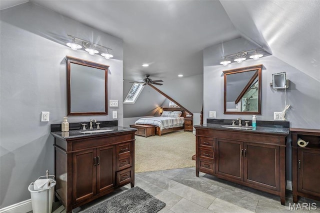 616 W Columbia St, Farmington, MO 63640 - bathroom with two vanities, vaulted ceiling, a ceiling fan, recessed lighting, and ensuite bath
