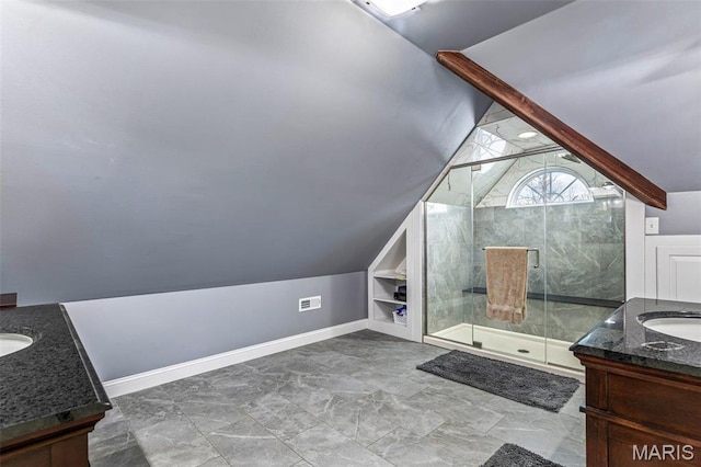 616 W Columbia St, Farmington, MO 63640 - full bathroom with vaulted ceiling, vanity, a shower stall, and built in features
