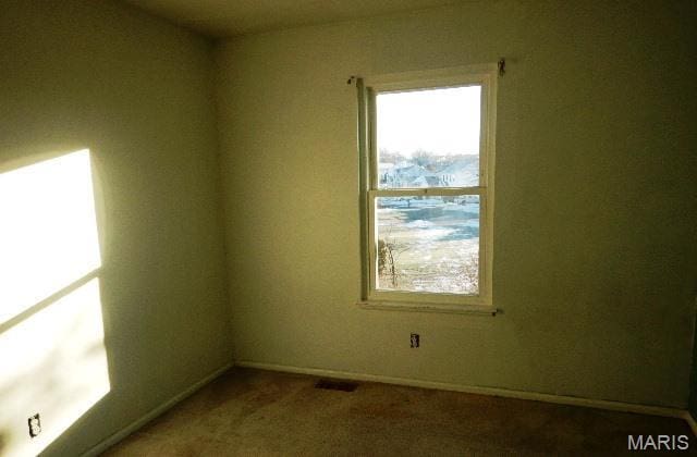 16 Garden Gate Ct, Saint Peters, MO 63304 - carpeted empty room featuring plenty of natural light and baseboards