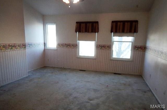 16 Garden Gate Ct, Saint Peters, MO 63304 - carpeted empty room featuring a wainscoted wall