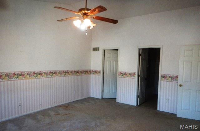 16 Garden Gate Ct, Saint Peters, MO 63304 - carpeted empty room featuring a wainscoted wall and a ceiling fan