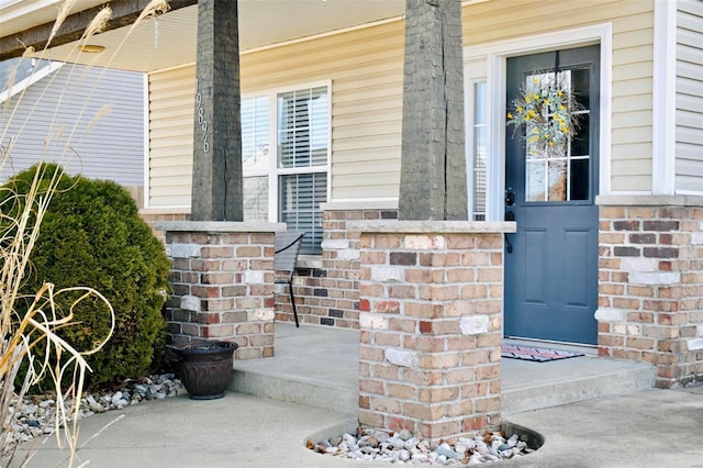 entrance to property featuring a porch
