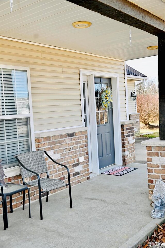 entrance to property with brick siding
