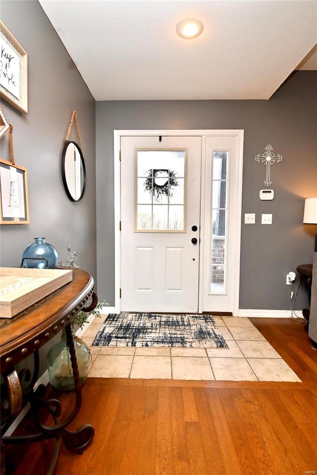 entrance foyer featuring wood finished floors and baseboards