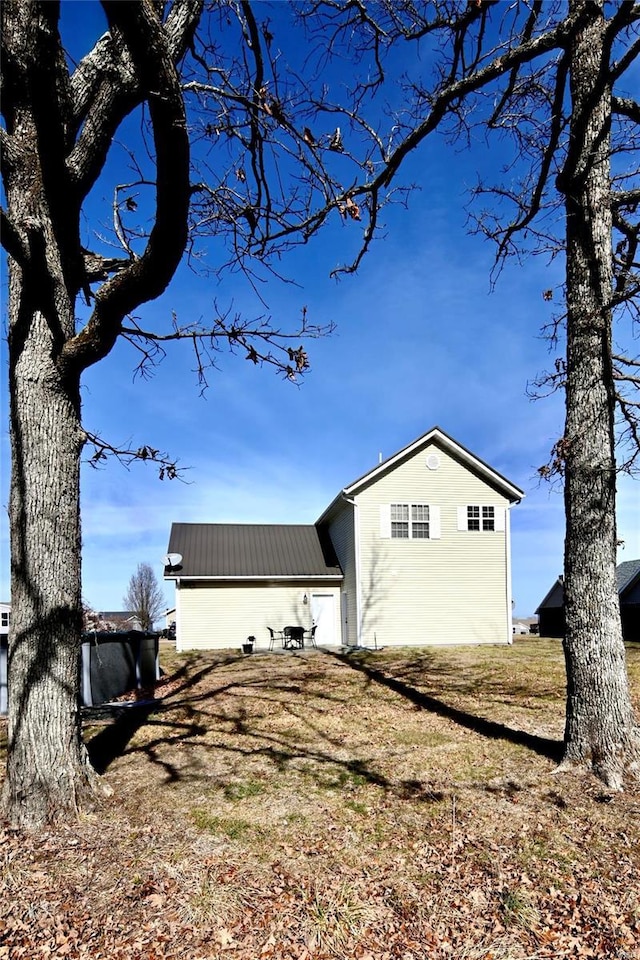 view of side of property with metal roof
