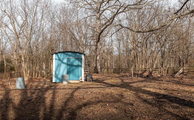 20020 Buffer Ln, Waynesville, MO 65583 - view of yard featuring a storage shed, an outdoor structure, and a wooded view