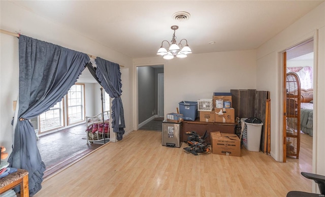 20020 Buffer Ln, Waynesville, MO 65583 - dining space with wood finished floors and a chandelier