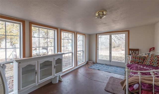 20020 Buffer Ln, Waynesville, MO 65583 - doorway with unfinished concrete flooring and a textured ceiling