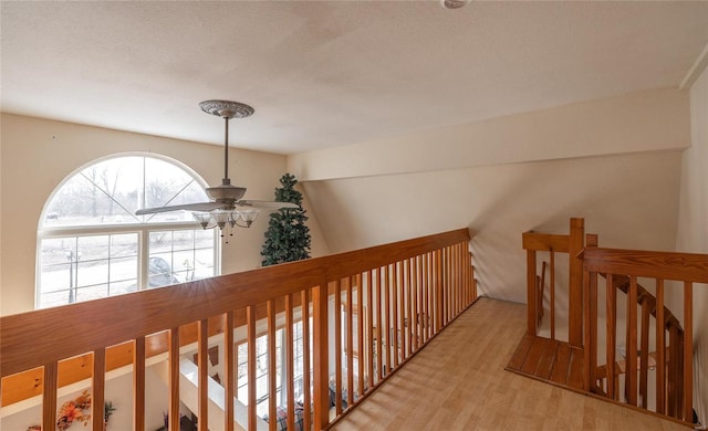 20020 Buffer Ln, Waynesville, MO 65583 - corridor with an upstairs landing, wood finished floors, and a textured ceiling