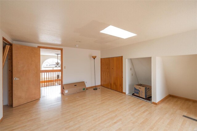 20020 Buffer Ln, Waynesville, MO 65583 - bonus room featuring light wood-type flooring, a skylight, and baseboards